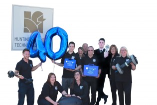 40 Years-PHO-02C-Group holding Balloon with HFT sign