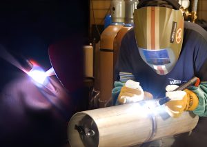 Welder working on metal pipe, bright welding light.