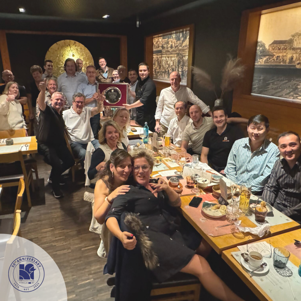 Group celebrating at restaurant for 35th anniversary.