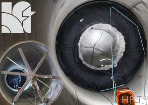 Large industrial pipe with inspection equipment inside.