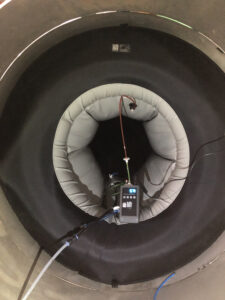 Inflatable pipe plug with pressure gauge inside tunnel.