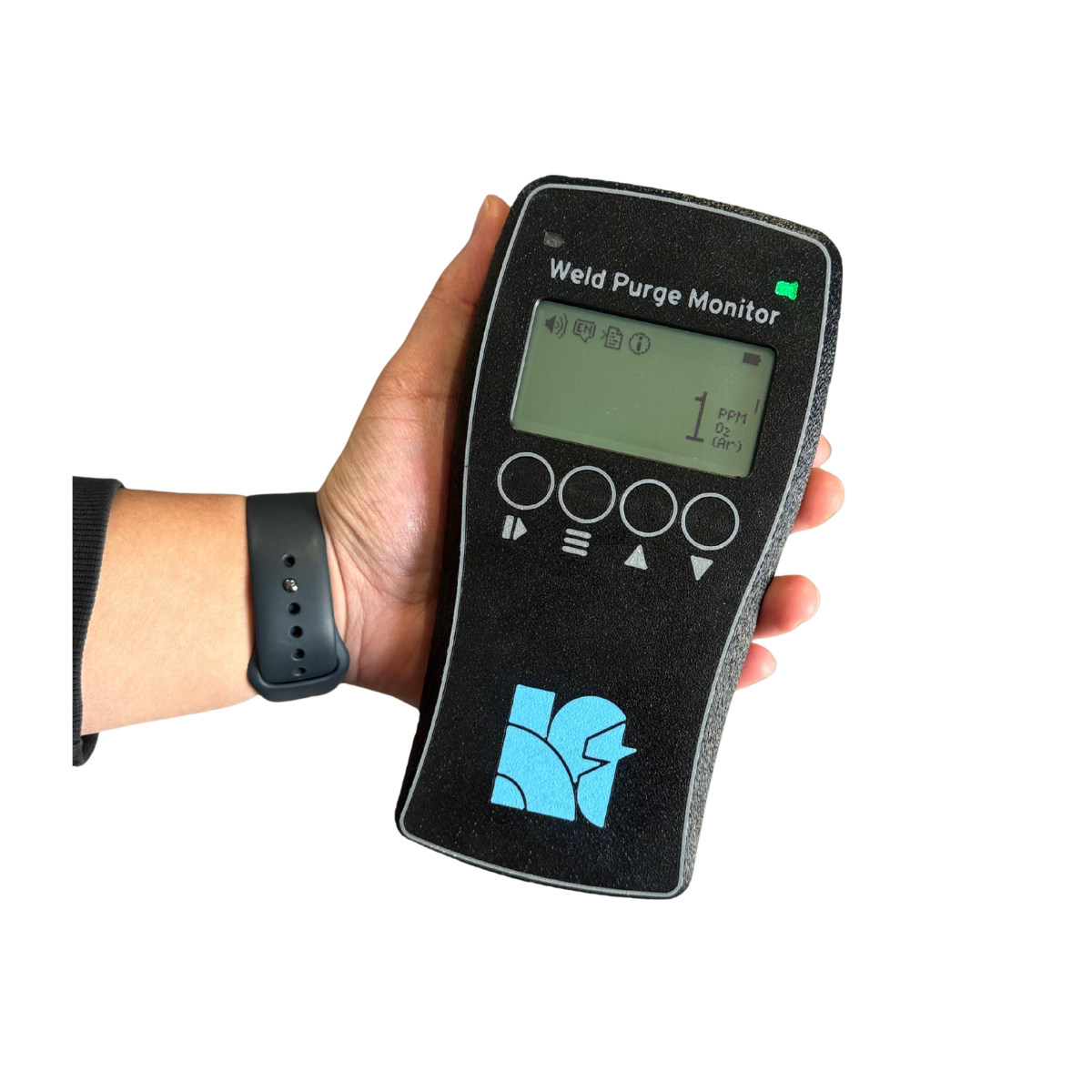 Hand holding a weld purge monitor device.